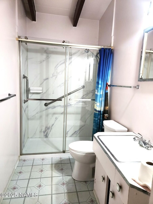 bathroom with vanity, toilet, and a marble finish shower