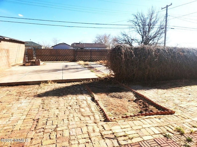 view of yard with a patio and fence