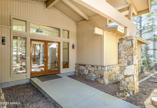 entrance to property with stone siding and french doors