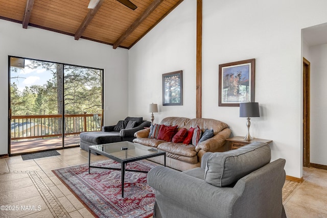 living room with high vaulted ceiling, light tile patterned flooring, wood ceiling, baseboards, and beam ceiling