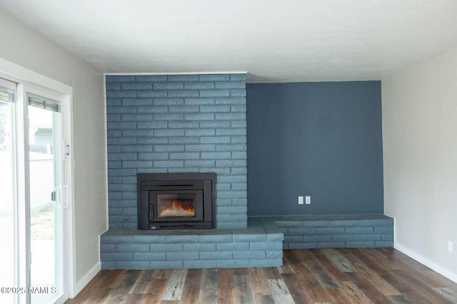 73 Seneca Dr, Flagstaff, AZ 86005 - unfurnished living room with baseboards, a fireplace, and wood finished floors