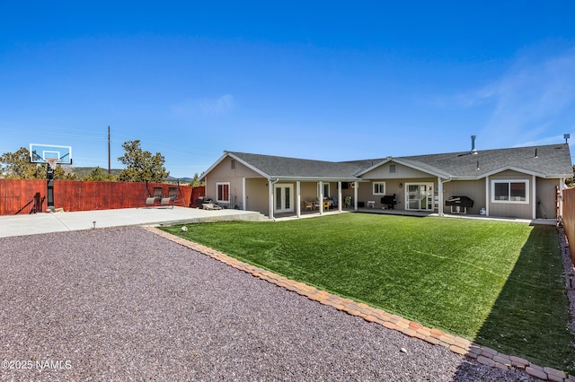 ranch-style home with a patio area and a front yard