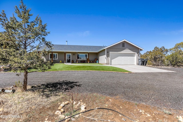 single story home with a garage and a front lawn