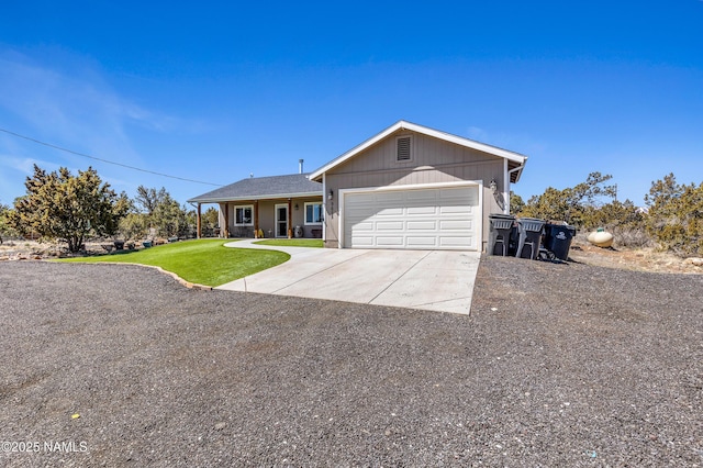 ranch-style house featuring a garage and a front yard