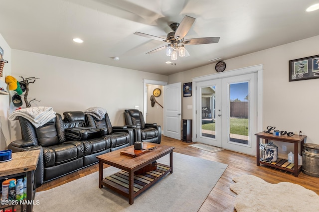 living room featuring french doors, ceiling fan, and hardwood / wood-style floors