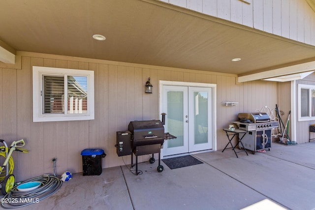 entrance to property featuring a patio area and french doors