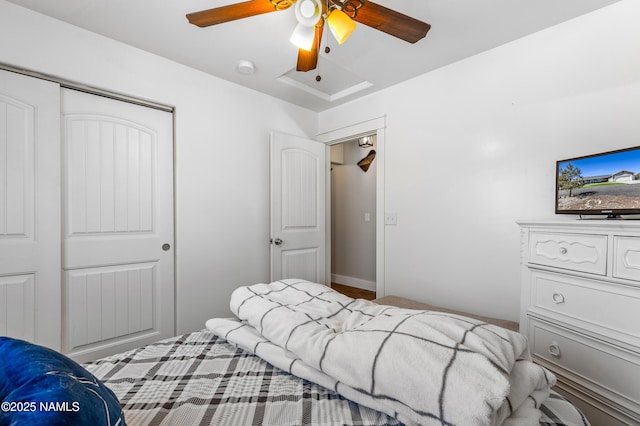 bedroom featuring ceiling fan and a closet