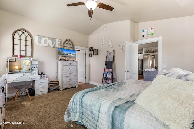 carpeted bedroom with vaulted ceiling and ceiling fan