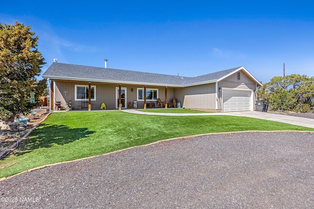 ranch-style house with a garage and a front lawn