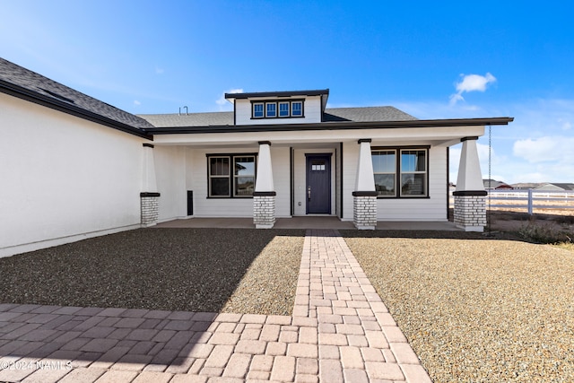 entrance to property featuring a porch