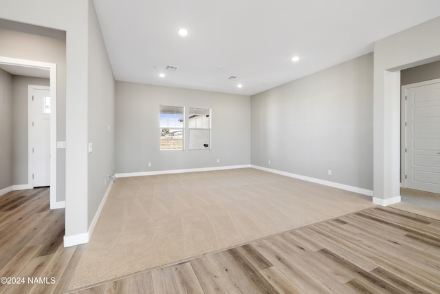 unfurnished living room featuring light wood-type flooring