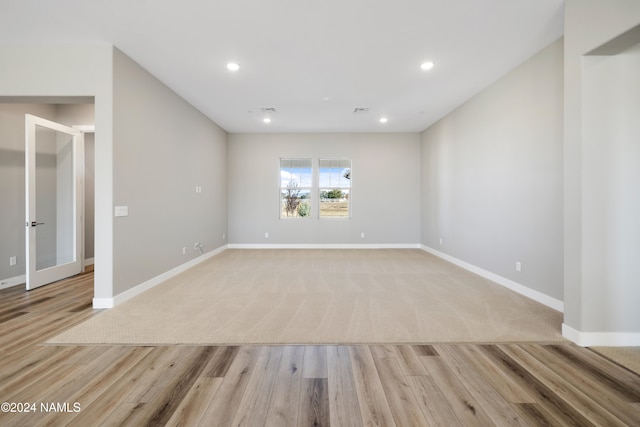 spare room with light wood-type flooring