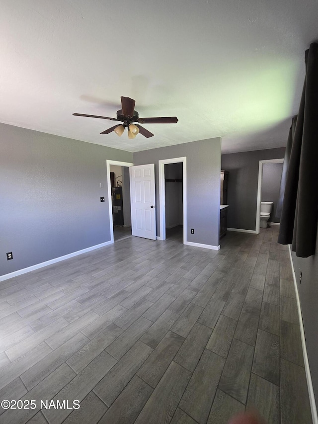 5895 Timberline Trl, Flagstaff, AZ 86004 - interior space with baseboards, ceiling fan, and dark wood-type flooring