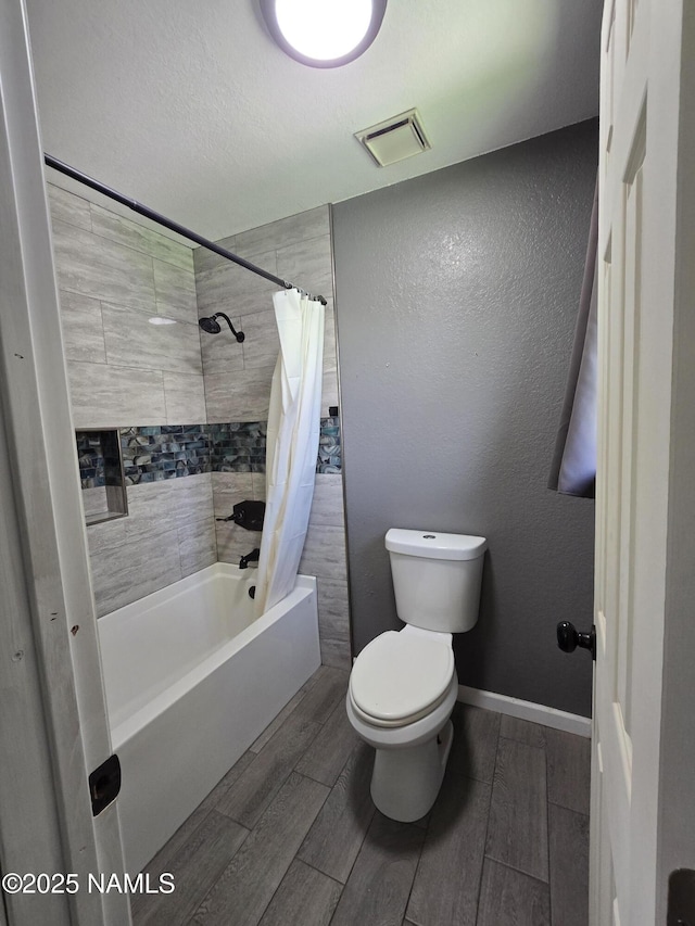 5895 Timberline Trl, Flagstaff, AZ 86004 - full bathroom featuring shower / bath combo, wood finish floors, toilet, and visible vents