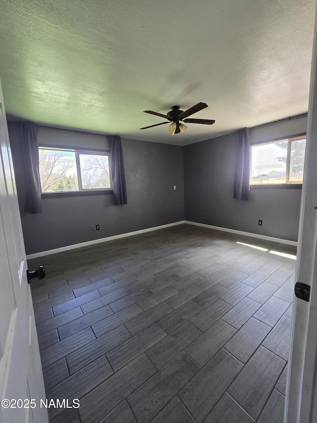 5895 Timberline Trl, Flagstaff, AZ 86004 - spare room with baseboards, a textured ceiling, ceiling fan, and wood finish floors