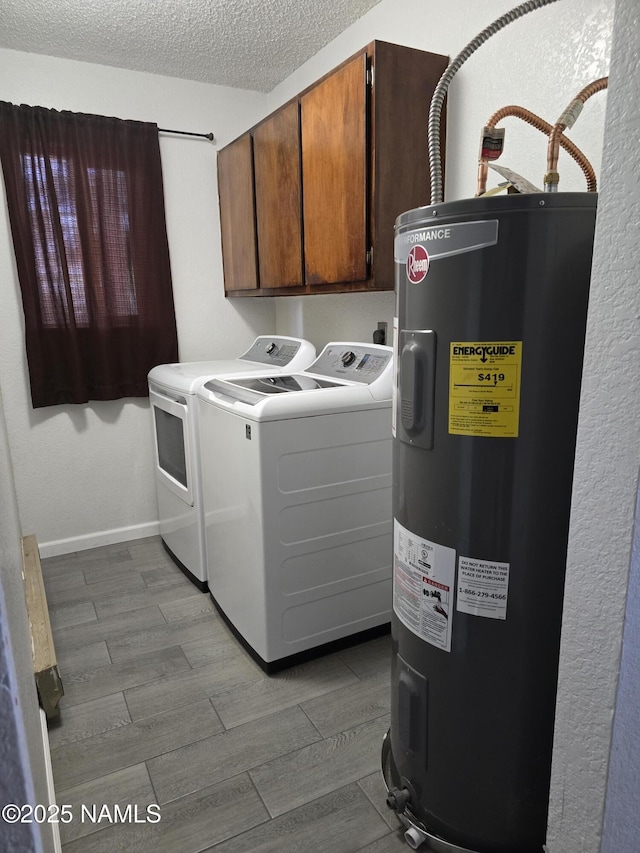 5895 Timberline Trl, Flagstaff, AZ 86004 - laundry room featuring cabinet space, dark wood-style flooring, a textured ceiling, water heater, and washer and clothes dryer