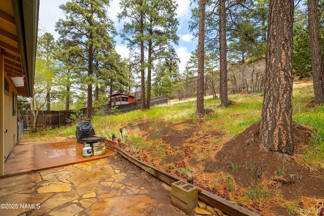 6160 N Dodge Ave, Flagstaff, AZ 86004 - fenced backyard with a patio area