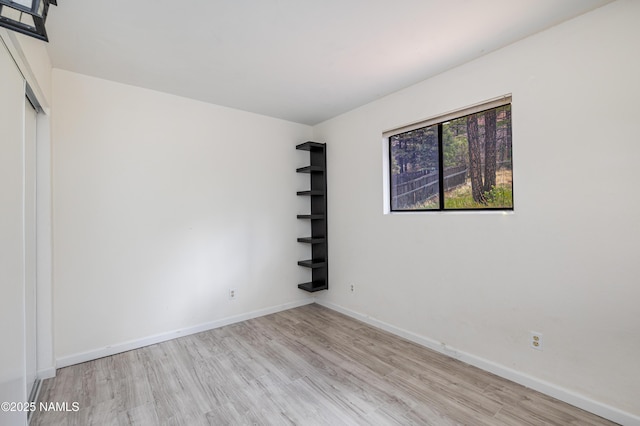 6160 N Dodge Ave, Flagstaff, AZ 86004 - empty room with wood finished floors and baseboards