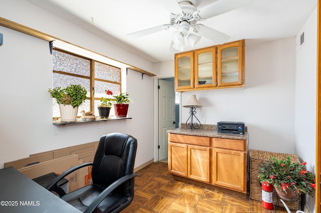 office with visible vents and ceiling fan