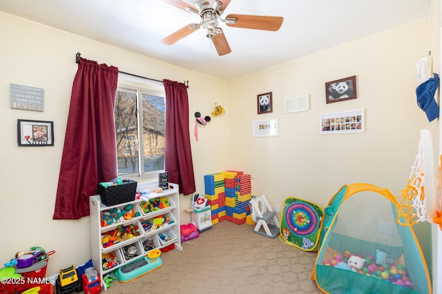 game room with carpet floors and ceiling fan