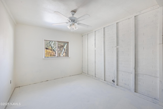 spare room with concrete flooring and ceiling fan