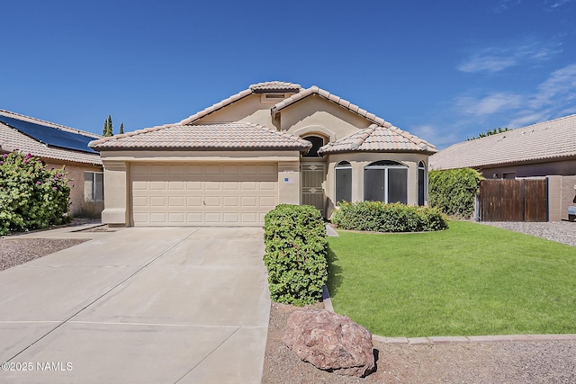18525 N 85th Ave, Peoria, AZ 85382 - mediterranean / spanish house featuring driveway, a garage, a tiled roof, and stucco siding