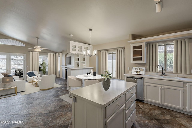 18525 N 85th Ave, Peoria, AZ 85382 - kitchen with stainless steel dishwasher, a center island, lofted ceiling, plenty of natural light, and light countertops