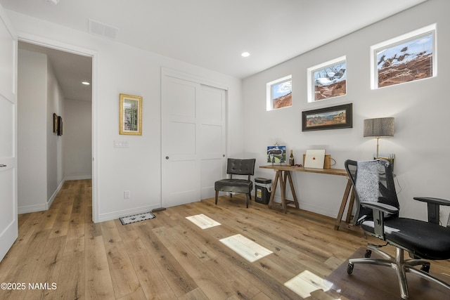 office area featuring recessed lighting, visible vents, light wood-style flooring, and baseboards