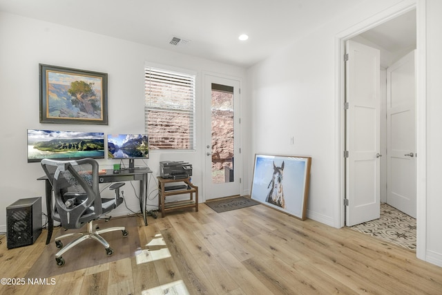 home office with recessed lighting, wood finished floors, visible vents, and baseboards