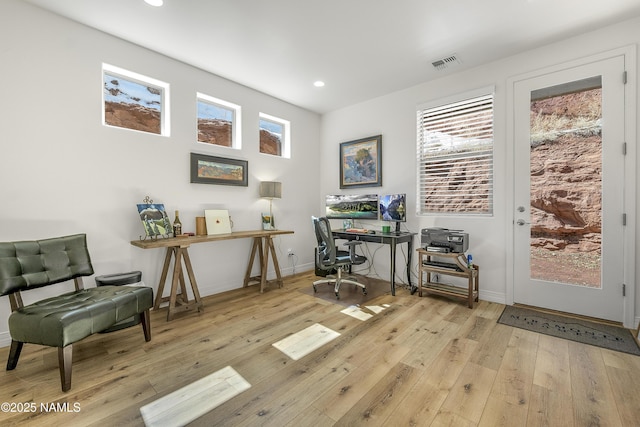 home office featuring recessed lighting, visible vents, baseboards, and hardwood / wood-style flooring