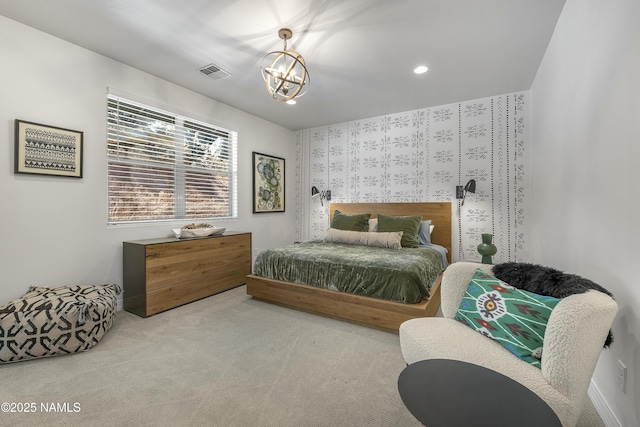 carpeted bedroom with recessed lighting, visible vents, and a chandelier