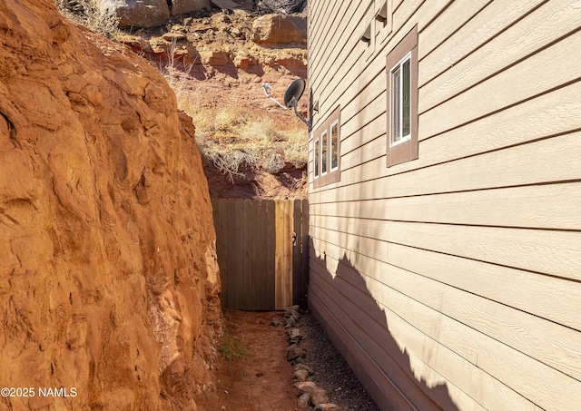 view of property exterior featuring fence