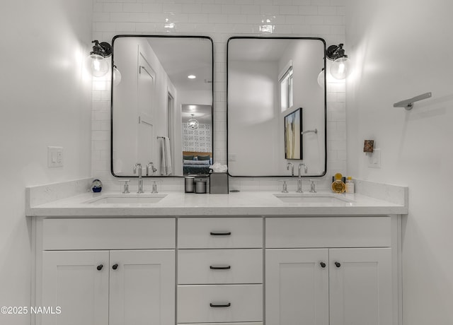 full bathroom featuring a sink and double vanity