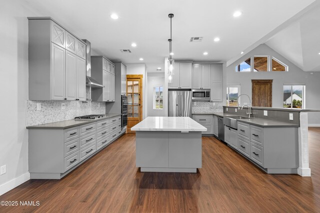 7497 W Dreamview Trl, Flagstaff, AZ 86001 - kitchen featuring appliances with stainless steel finishes, a peninsula, a sink, gray cabinetry, and recessed lighting