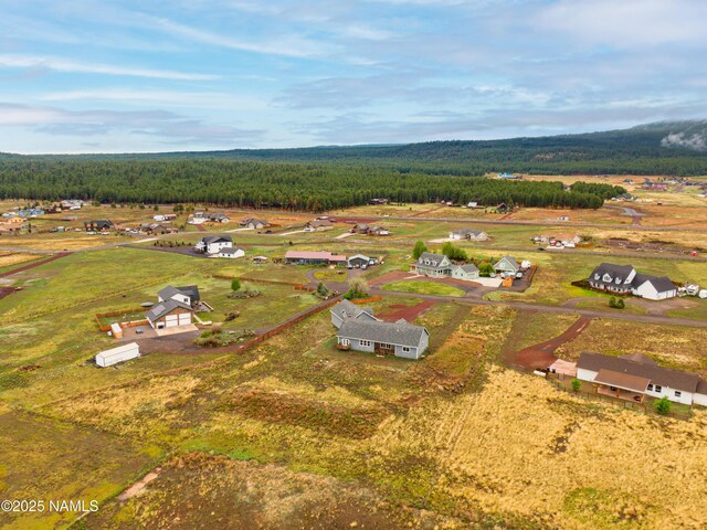 7497 W Dreamview Trl, Flagstaff, AZ 86001 - aerial view of residential area with a heavily wooded area