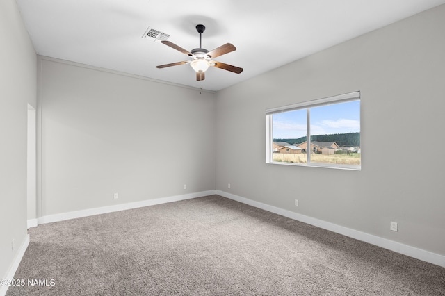 7497 W Dreamview Trl, Flagstaff, AZ 86001 - carpeted spare room featuring a ceiling fan and baseboards