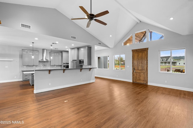 7497 W Dreamview Trl, Flagstaff, AZ 86001 - unfurnished living room featuring a ceiling fan, healthy amount of natural light, dark wood-style flooring, recessed lighting, and high vaulted ceiling