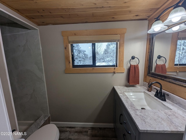 full bathroom with vanity, wooden ceiling, plenty of natural light, and toilet