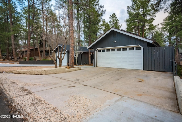 exterior space featuring concrete driveway