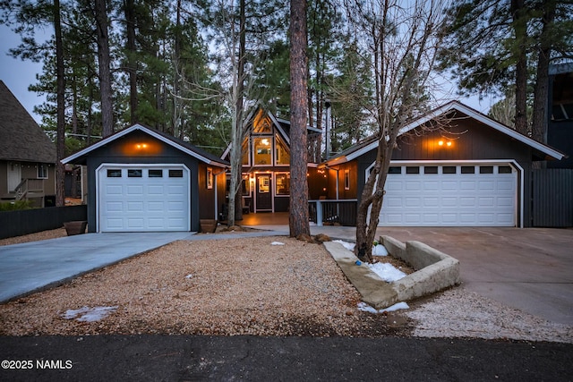 view of front of home featuring covered porch, driveway, and an attached garage