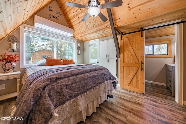 bedroom featuring vaulted ceiling, wood ceiling, a barn door, and wood finished floors