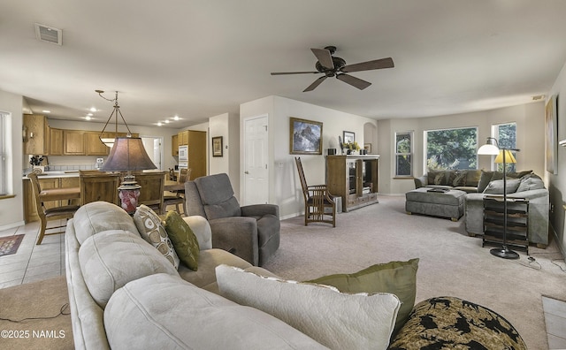 2545 N Broken Circle Rd, Flagstaff, AZ 86004 - living room with baseboards, a ceiling fan, and light carpet