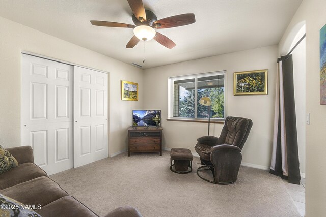 2545 N Broken Circle Rd, Flagstaff, AZ 86004 - sitting room with ceiling fan, light colored carpet, and baseboards