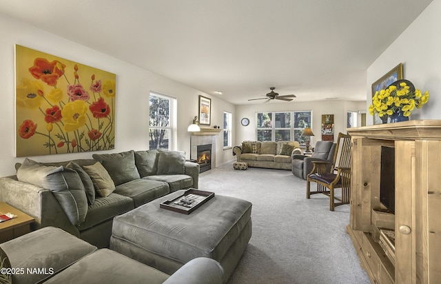 2545 N Broken Circle Rd, Flagstaff, AZ 86004 - living area featuring carpet floors, a tiled fireplace, and a ceiling fan