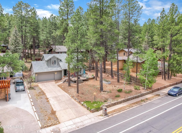 2606 N Fremont Blvd, Flagstaff, AZ 86001 - view of front of property featuring driveway, a shingled roof, and a garage