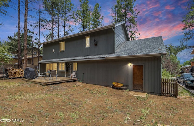 2606 N Fremont Blvd, Flagstaff, AZ 86001 - back of property at dusk featuring a wooden deck and a shingled roof