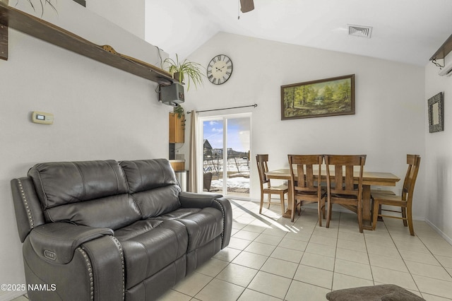 living room with lofted ceiling, light tile patterned floors, visible vents, and ceiling fan