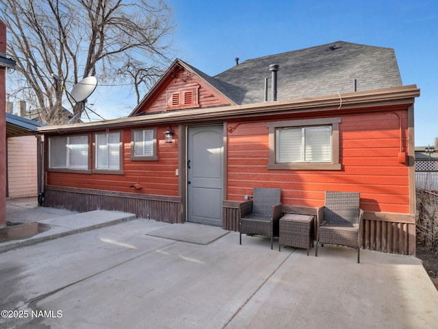 back of property with a patio area