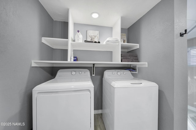 425 W Rte 66, Williams, AZ 86046 - clothes washing area with wood-type flooring and washing machine and dryer