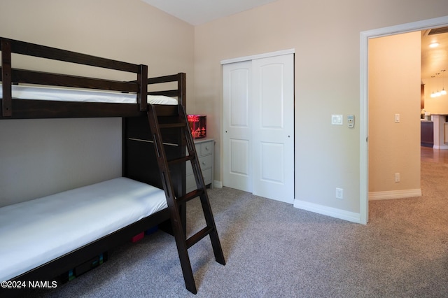 bedroom with carpet floors and a closet